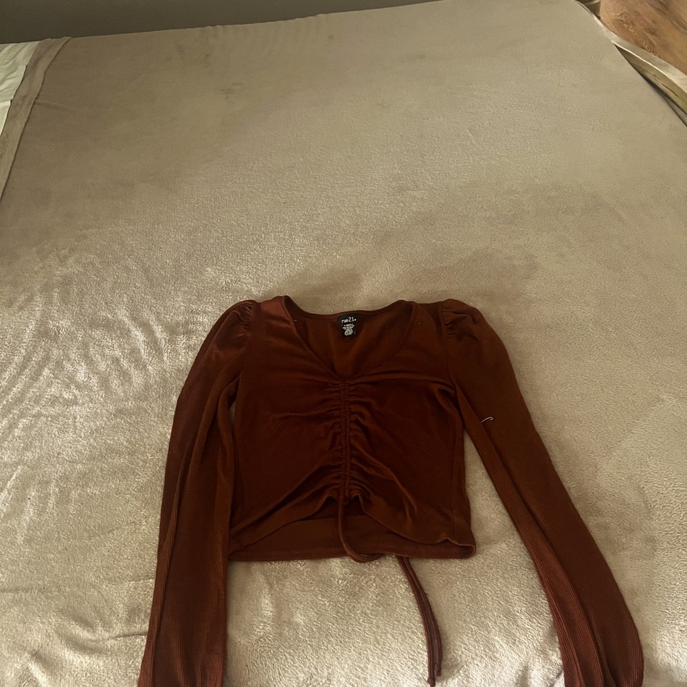 Extra small long sleeve top only worn it a couple time still in good shape .